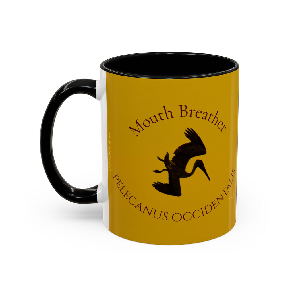 Yellow mug with black handle featuring a diving pelican design and text on a white background
