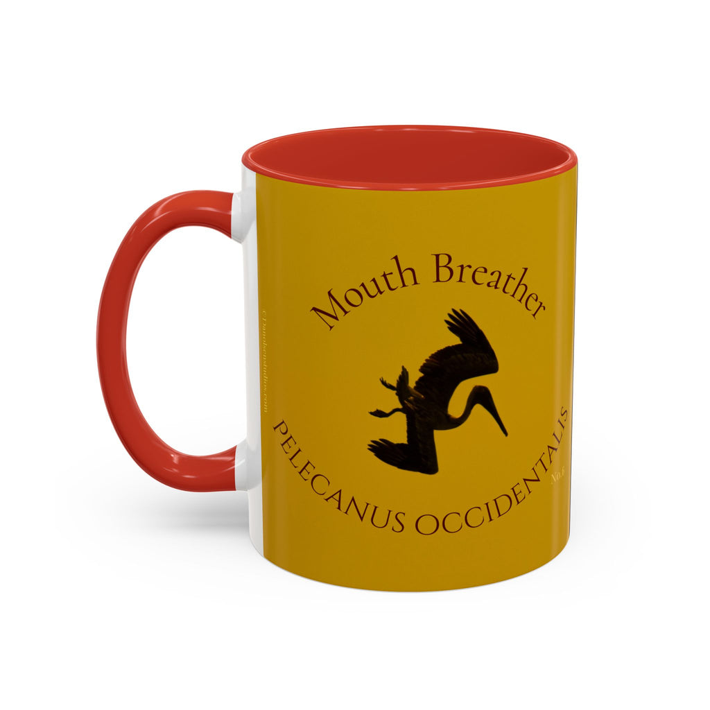 Yellow mug with red interior and handle featuring a diving pelican design and text.