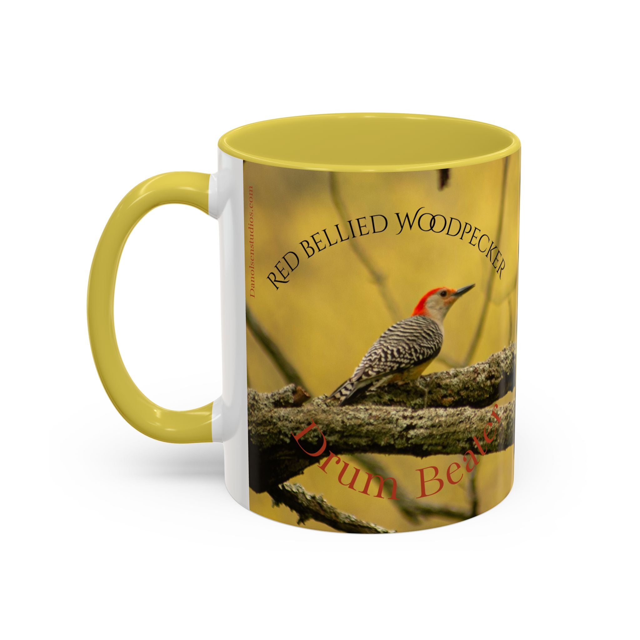 Yellow mug with a red-bellied woodpecker design on a white background